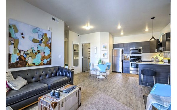 Cozy living room with modern furnishings at Avanti at Farmington Station Apartments