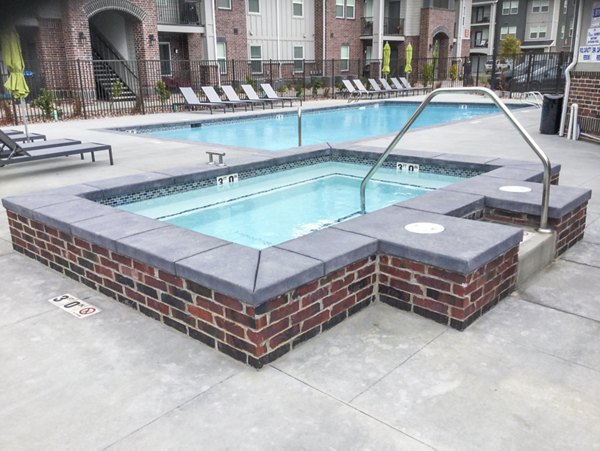 Relaxing hot tub at Avanti at Farmington Station Apartments offering luxurious amenities for residents to unwind and enjoy leisure time
