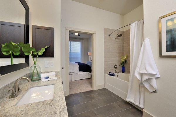 Modern bathroom featuring sleek fixtures and elegant finishes at Broadstone Energy Park Apartments