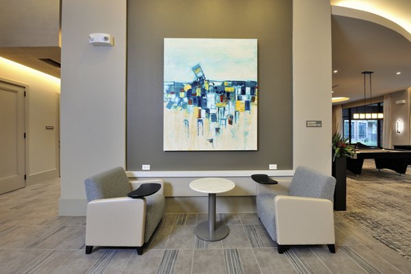 Clubhouse with elegant furnishings and modern decor at Broadstone Energy Park Apartments A luxury community feature in Houston