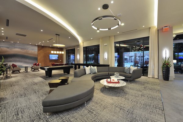 Clubhouse featuring modern design and seating at Broadstone Energy Park Apartments