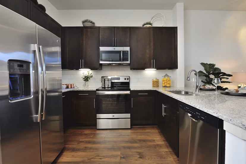 Modern kitchen with stainless steel appliances at Broadstone Energy Park Apartments