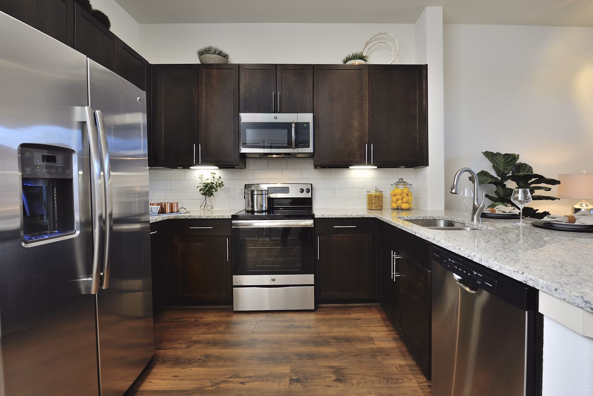 Modern kitchen with stainless steel appliances at Broadstone Energy Park Apartments