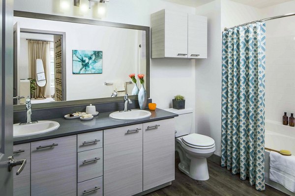 Luxurious bathroom with double vanity at Jefferson Platinum Triangle Apartments in Anaheim