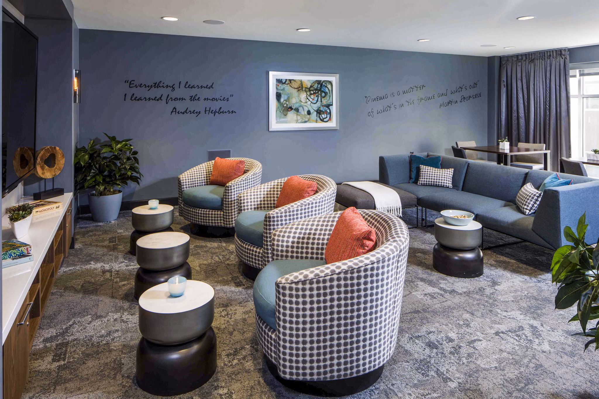 Modern clubhouse with sleek decor and seating at Jefferson Platinum Triangle Apartments, perfect for luxury living and community events