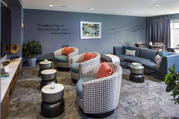 Modern clubhouse with sleek decor and seating at Jefferson Platinum Triangle Apartments, perfect for luxury living and community events