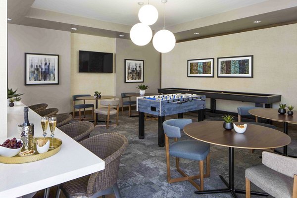 Jefferson Platinum Triangle Apartments: Modern game room with pool table and lounge seating for luxury living