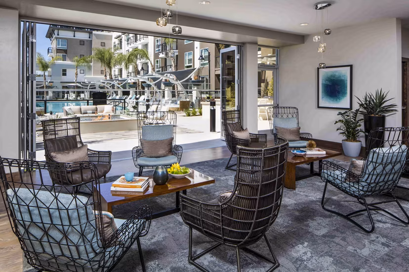 Clubhouse pool patio with lounge seating at Jefferson Platinum Triangle Apartments in Anaheim