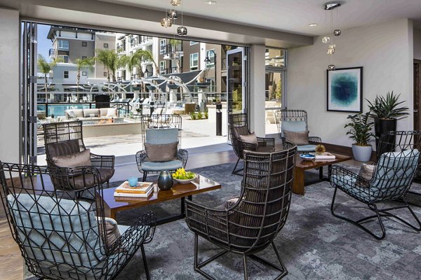 Clubhouse pool patio with lounge seating at Jefferson Platinum Triangle Apartments in Anaheim