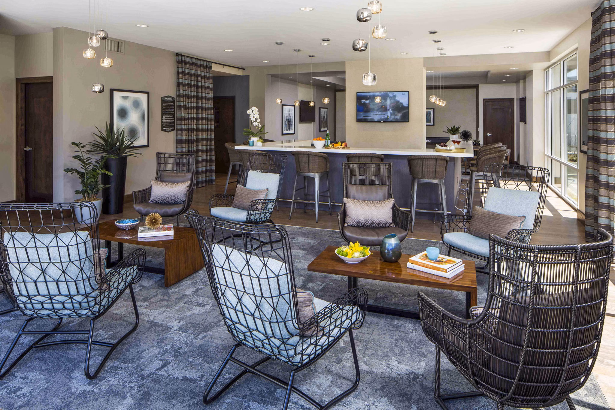 Clubhouse pool patio with lounge chairs at Jefferson Platinum Triangle Apartments, offering a relaxing outdoor experience in a luxury setting