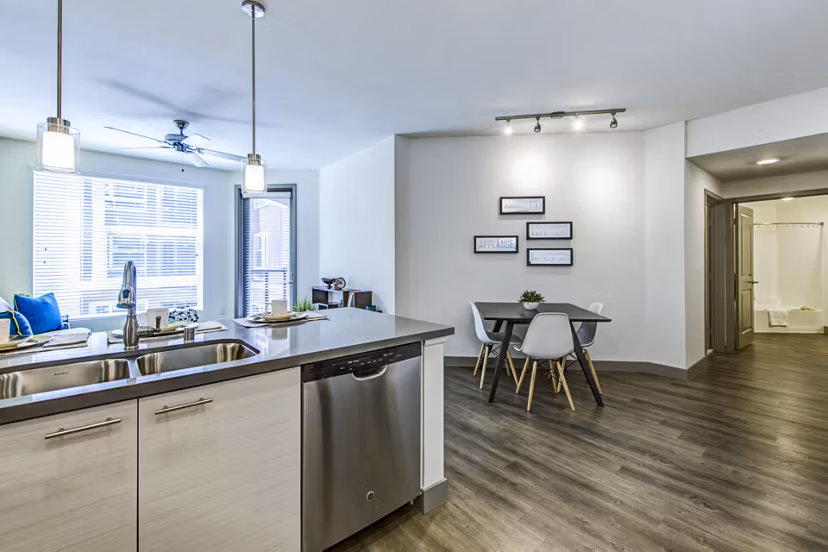 Modern kitchen with stainless steel appliances at Jefferson Platinum Triangle Apartments