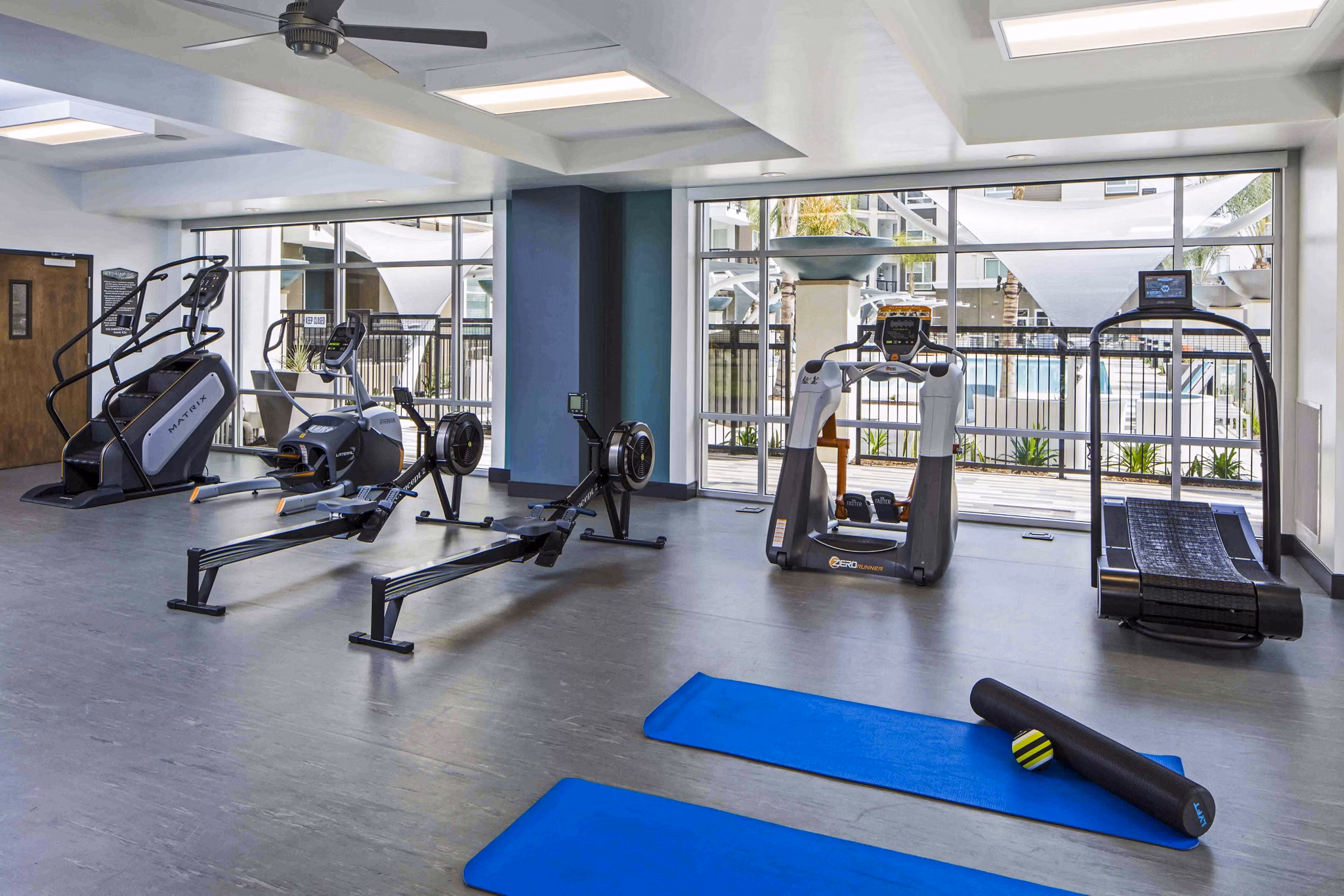Fitness center with modern equipment at Jefferson Platinum Triangle Apartments