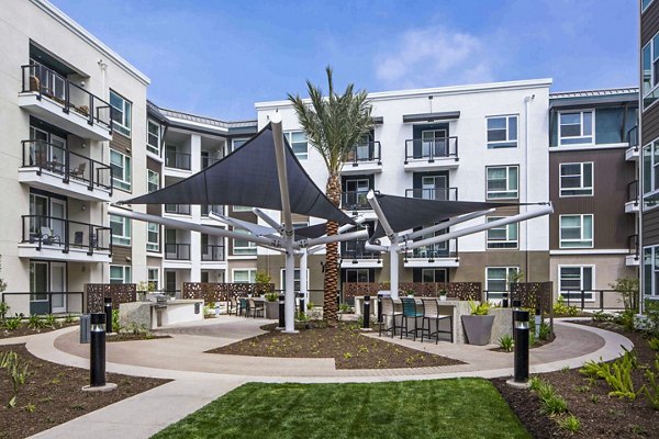 Grill area with modern seating at Jefferson Platinum Triangle Apartments
