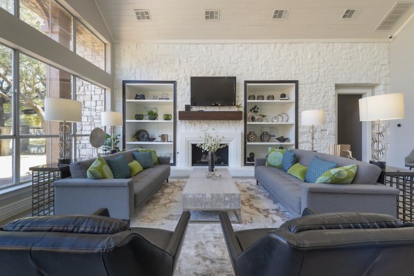 Clubhouse with modern design and cozy seating at Settler's Gate Apartments