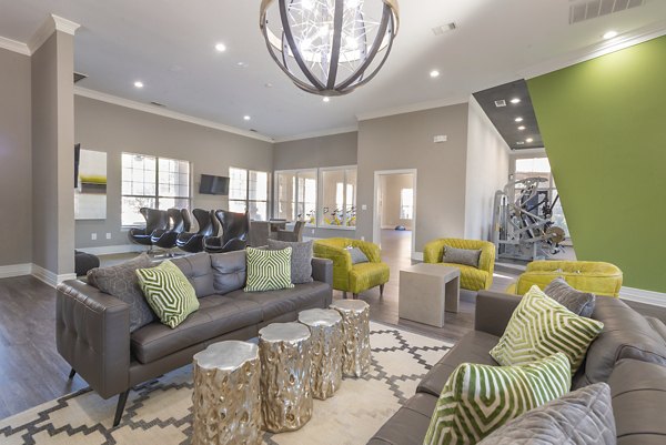 Clubhouse with cozy lounge and modern design at Settler's Gate Apartments
