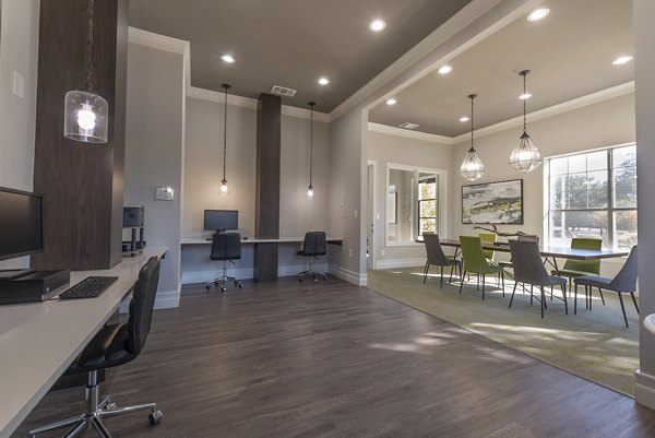 Clubhouse featuring modern design and cozy seating at Settler's Gate Apartments