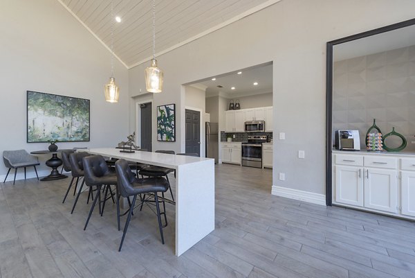 Elegant clubhouse with cozy seating and modern design at Settler's Gate Apartments, perfect for community gatherings and events