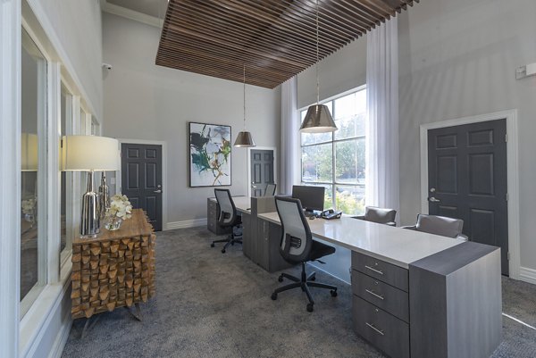 Contemporary clubhouse with modern furnishings at Settler's Gate Apartments, ideal for hosting events and socializing in style