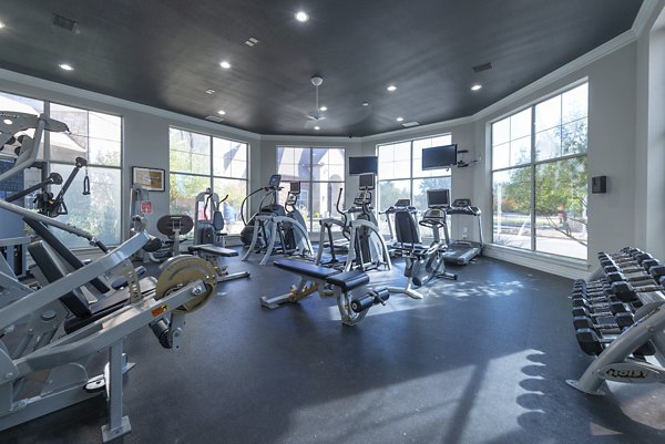 Yoga and spin studio with state-of-the-art equipment at Settler's Gate Apartments, perfect for fitness enthusiasts seeking luxury living