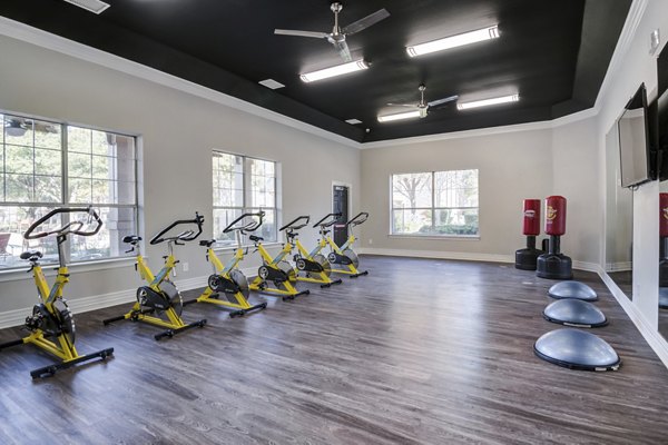 Modern fitness center with state-of-the-art equipment at Settler's Gate Apartments, ideal for luxury living and wellness enthusiasts