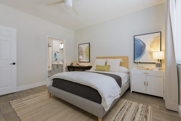 Cozy bedroom with elegant decor at Cantera Apartments, a Greystar luxury community