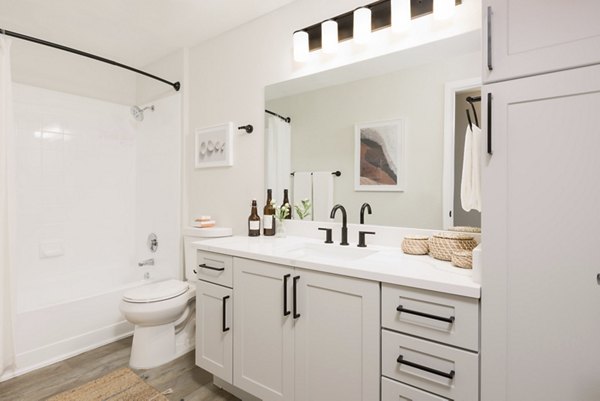 Luxurious bathroom with marble finishes and modern fixtures at Cantera Apartments