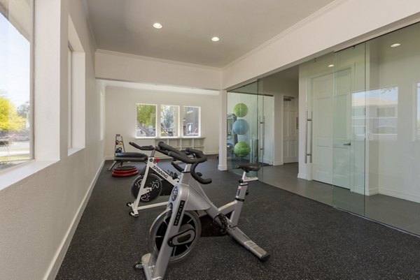 Yoga/spin studio with modern equipment at Cantera Apartments offering fitness amenities for a healthy lifestyle