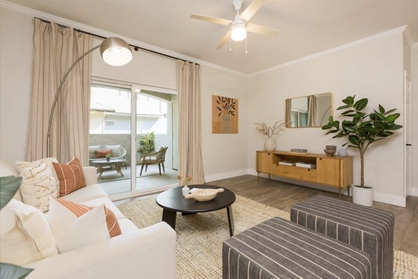 Spacious living room with modern decor and natural light at Cantera Apartments