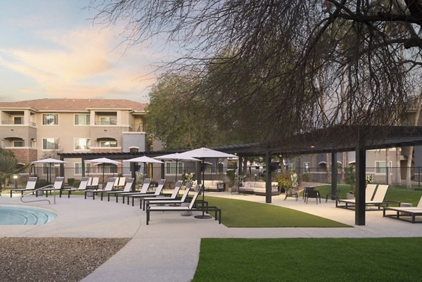 Spacious patio at Cantera Apartments featuring modern outdoor seating, ideal for dining and relaxation in luxury settings