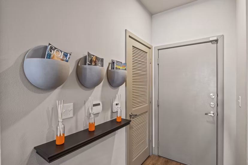 Contemporary hallway with sleek lighting and modern art at Avenue 900 Apartments