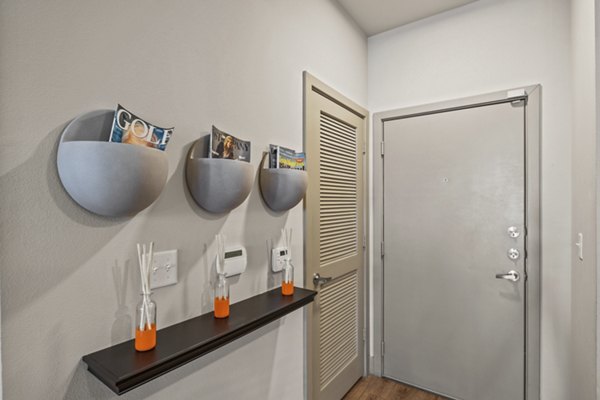 Contemporary hallway with sleek lighting and modern art at Avenue 900 Apartments