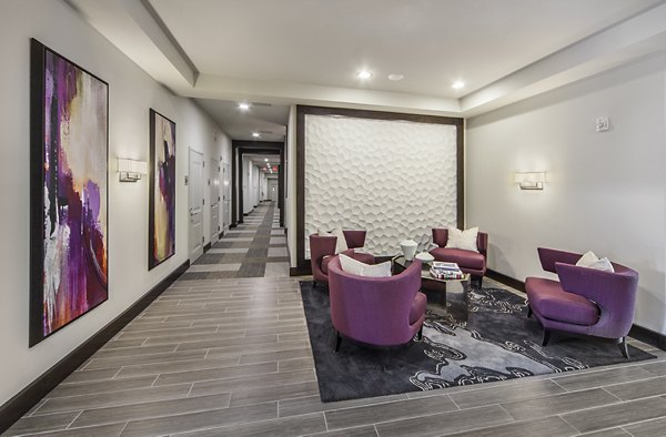 Clubhouse featuring modern design and communal seating at 221 Bergen Apartments