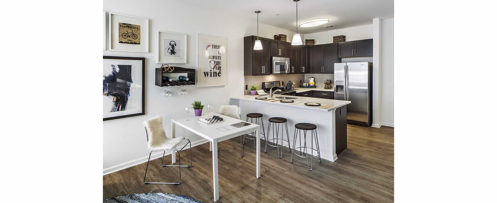 Dining area with sleek furniture and modern lighting at 221 Bergen Apartments, a luxury property in Greystar's collection
