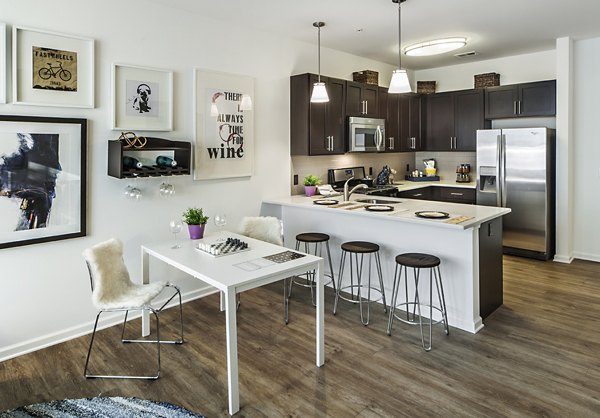 Dining area with sleek furniture and modern lighting at 221 Bergen Apartments, a luxury property in Greystar's collection