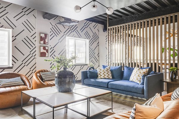 Elegant clubhouse interior at The Essex Apartments featuring comfortable seating and modern decor