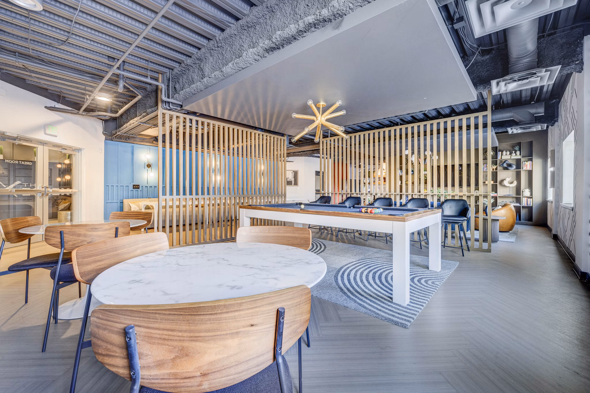 Clubhouse featuring modern design elements at The Essex Apartments, offering luxury amenities in a vibrant community setting