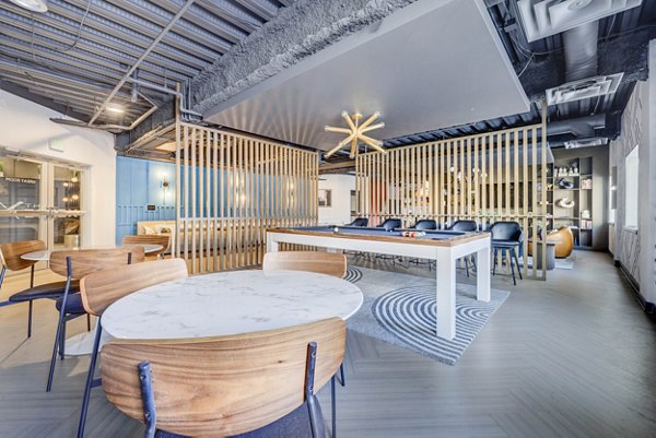 Clubhouse featuring modern design elements at The Essex Apartments, offering luxury amenities in a vibrant community setting