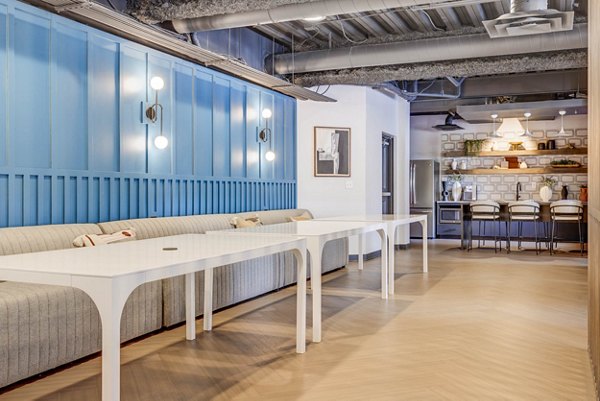 Clubhouse with modern decor and relaxed seating at The Essex Apartments