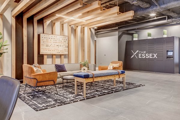 Clubhouse featuring modern design and spacious seating at The Essex Apartments