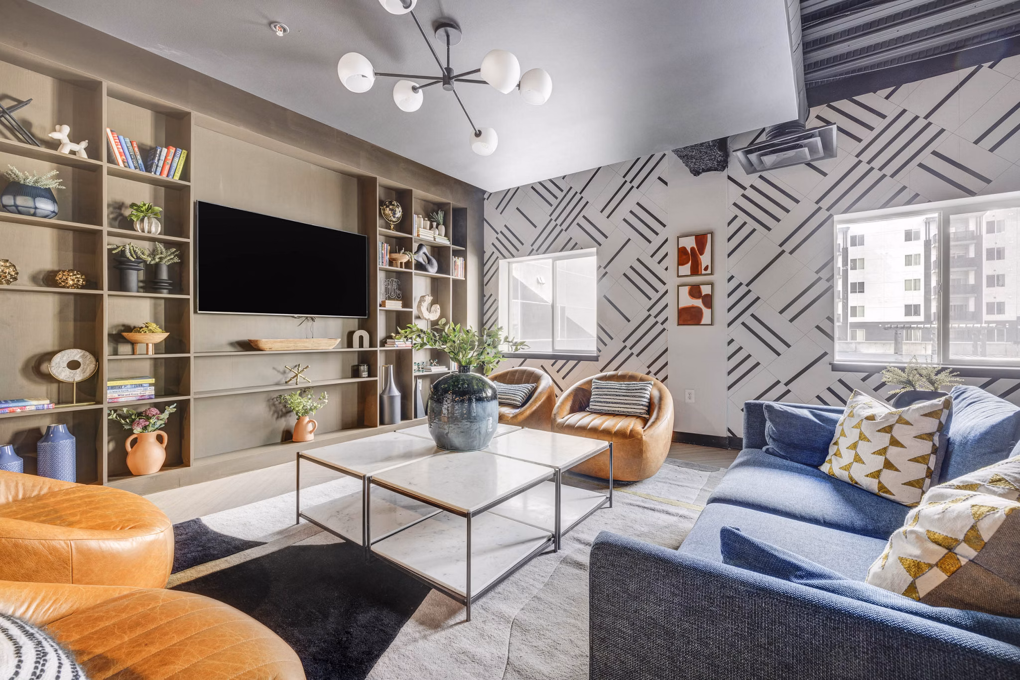 Elegant clubhouse featuring modern design and cozy seating at The Essex Apartments