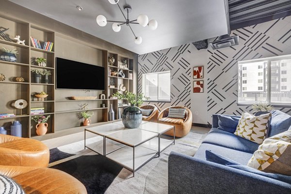 Elegant clubhouse featuring modern design and cozy seating at The Essex Apartments