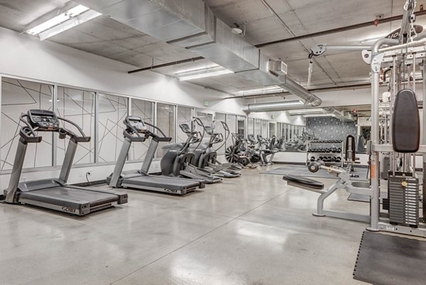 State-of-the-art fitness center at The Essex Apartments featuring modern equipment for a complete workout experience