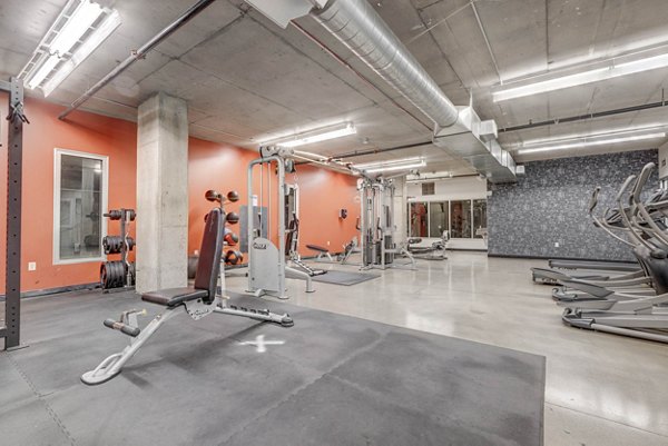 State-of-the-art fitness center with modern equipment at The Essex Apartments