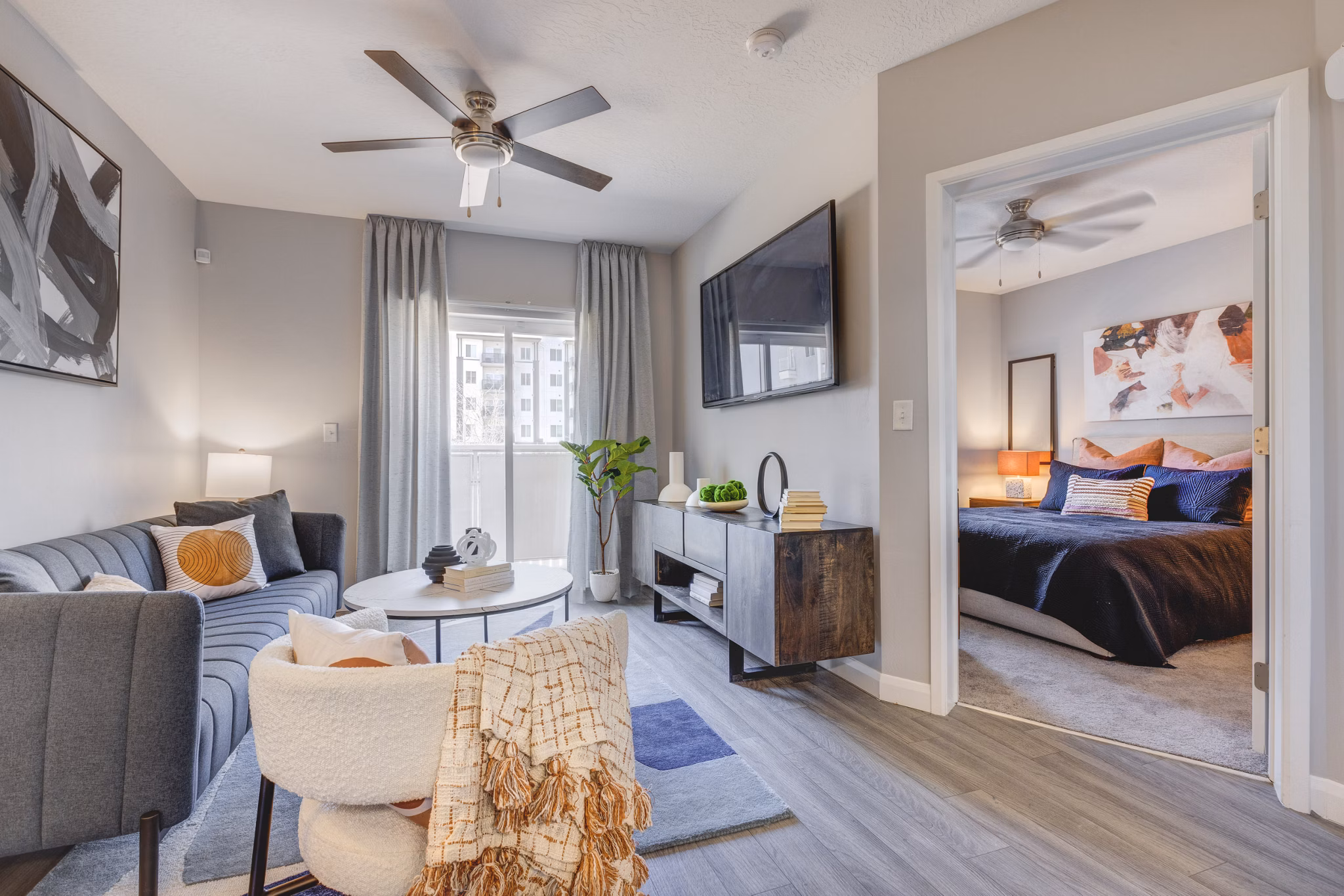 Spacious living room with modern design elements in The Essex Apartments