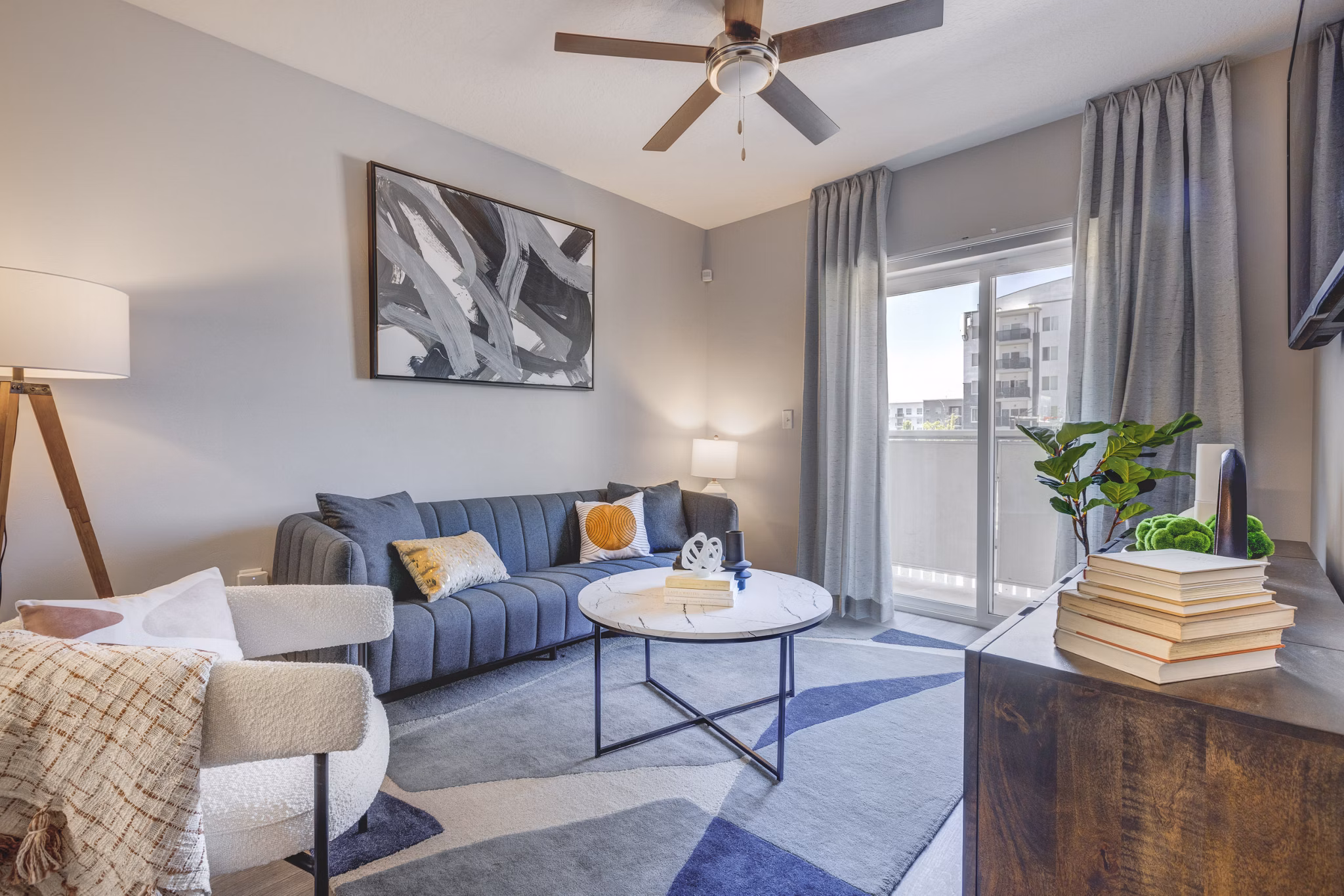 Modern living room with natural light in The Essex Apartments