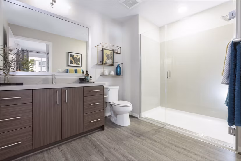 The Standard Apartments: Modern bathroom featuring sleek fixtures and elegant tilework