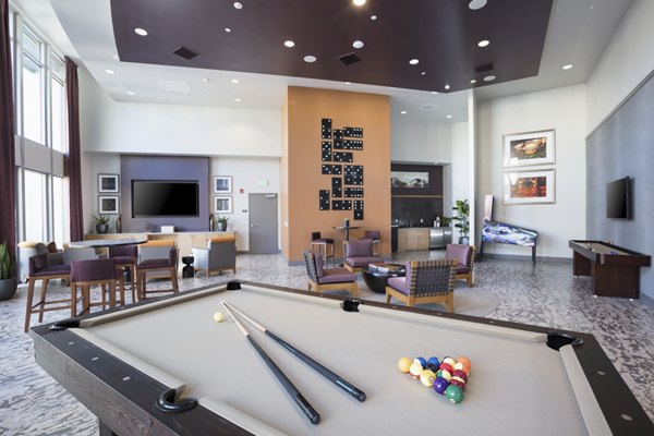 Modern clubhouse interior at The Standard Apartments featuring comfortable lounge seating and stylish decor