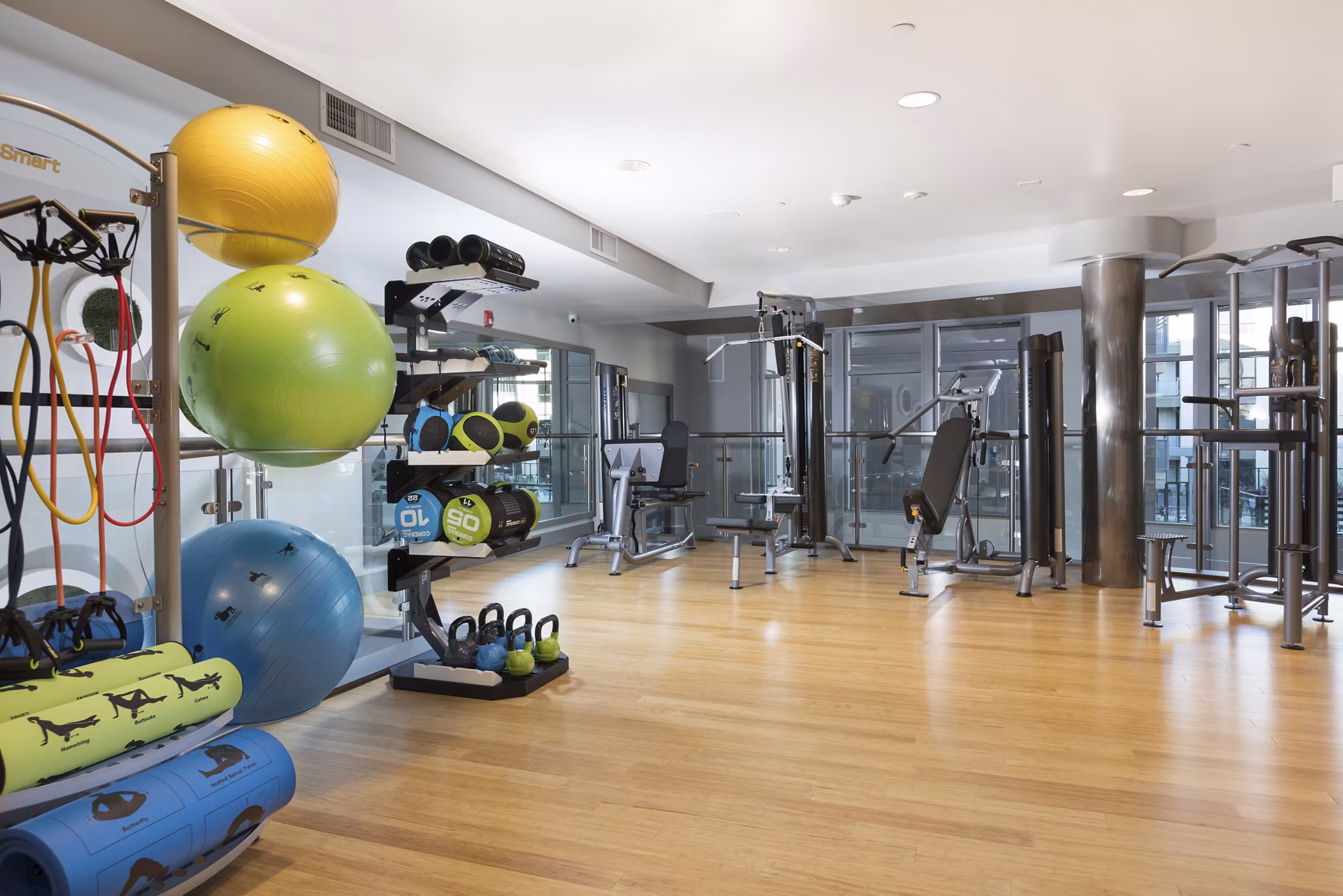 Fitness room with modern gym equipment at The Standard Apartments, offering a luxury workout experience for residents