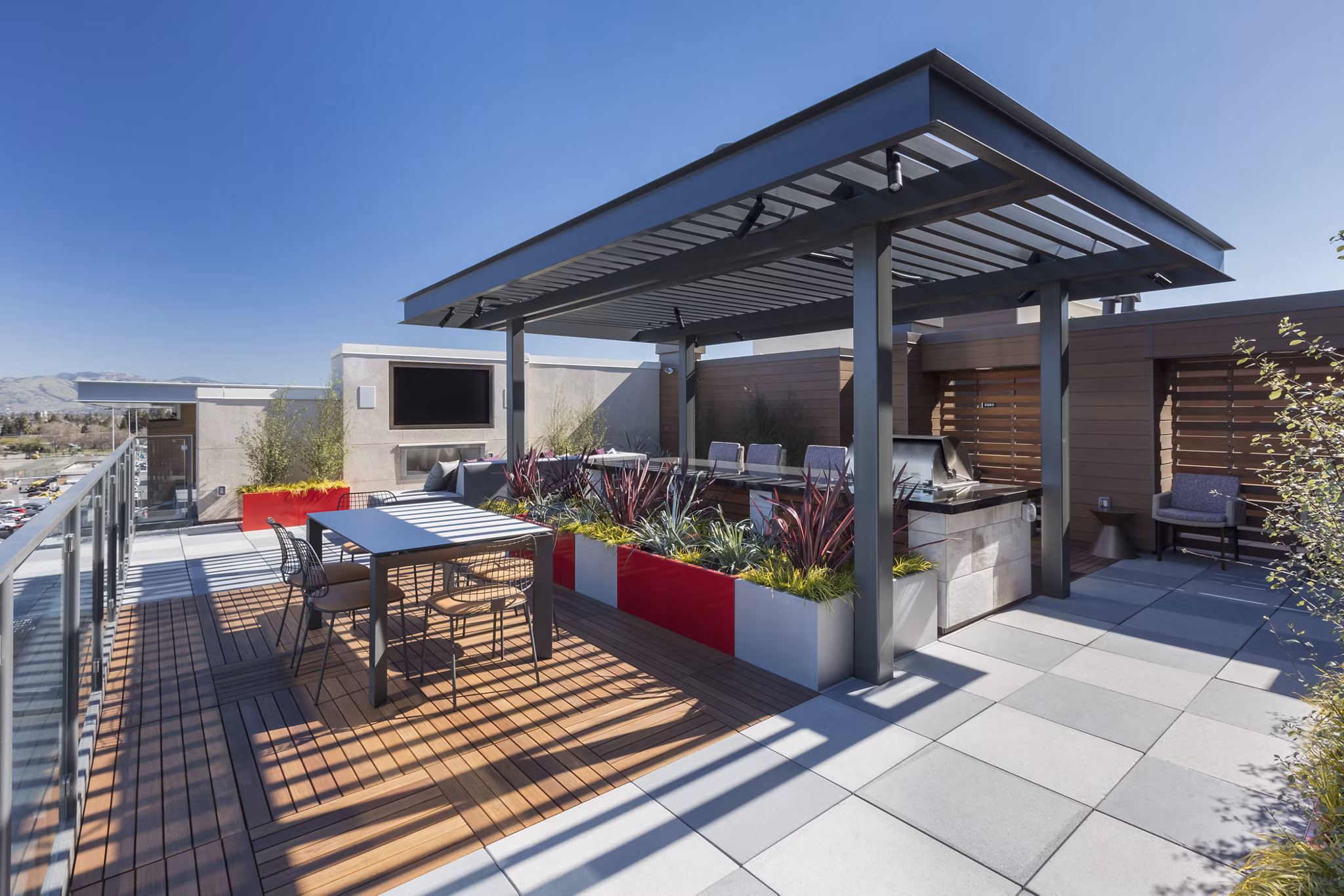 Grill area with modern seating at The Standard Apartments, luxury living with outdoor amenities