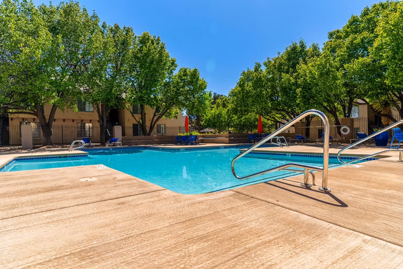 Outdoor pool surrounded by lush greenery at Union 505 Apartments, providing a luxurious relaxation spot near downtown amenities